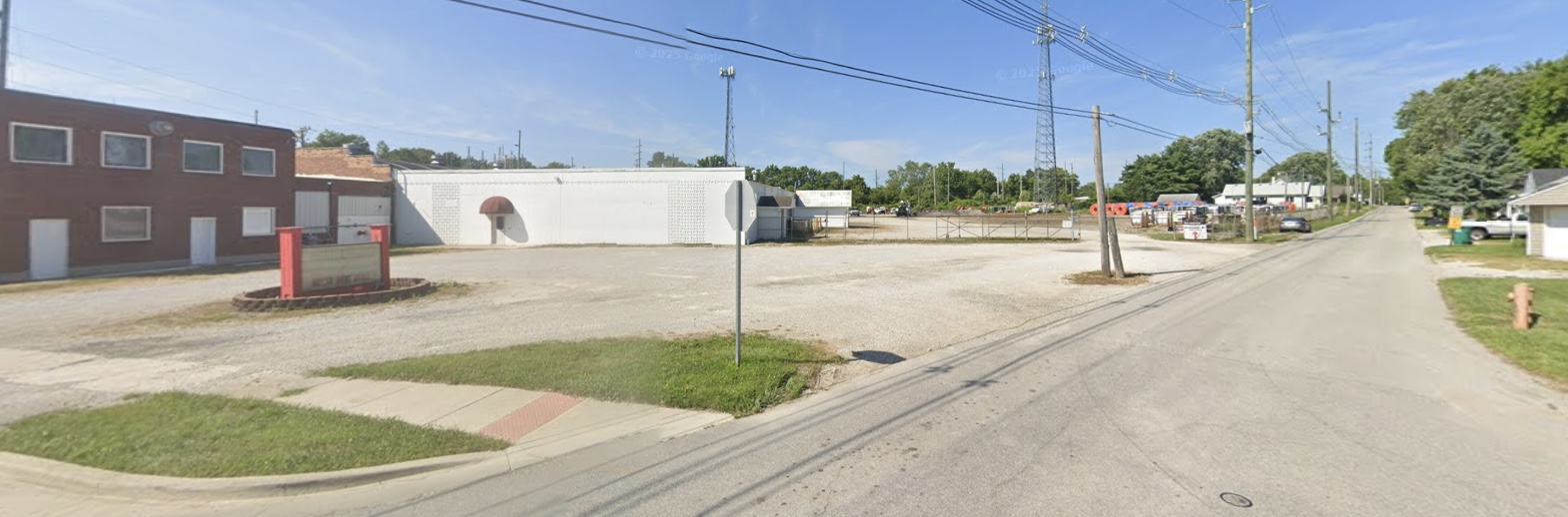 Street view of the brick office building and warehouse from Indianapolis Avenue